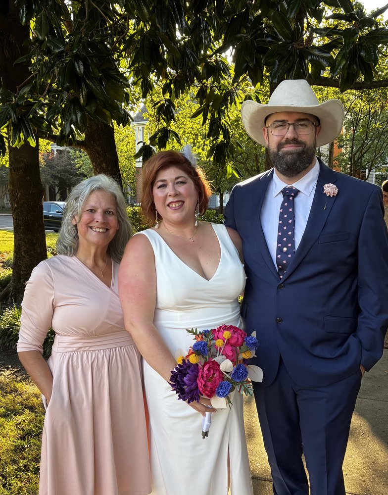 Beth with the bride and groom after their Harbor Town ceremony